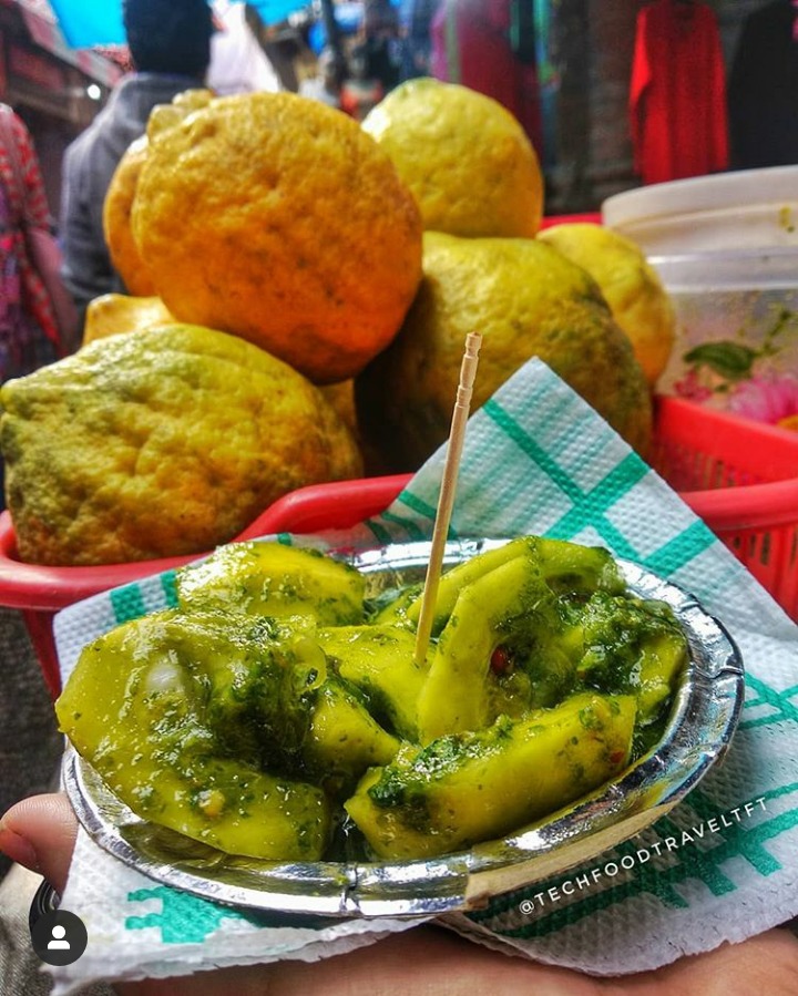 Kimb a citrus fruit is skinned, juice & seeds squeezed out and then mixed with spices, salt, bit of sugar etc. A sweet, sour and spicy snack commonly prepared in many homes, but rare to find it for sale.