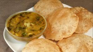 Lucchi is prepared by deep frying a roti made up of white flour, without making it crisp. It is served with a delicious potato curry. Lucchi is also known as Poori in other parts of the country. 