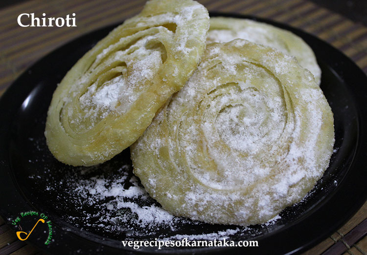 Chiroti is a delicacy predominantly served in Karnataka.It's prepared by rolling out kneaded dough made of maida into layered circular shapes and then deep frying in gheel. The outcome resembles a semi golden brown fluffy poori, which is then sprinkled with powdered sugar and grated almonds and cashews.