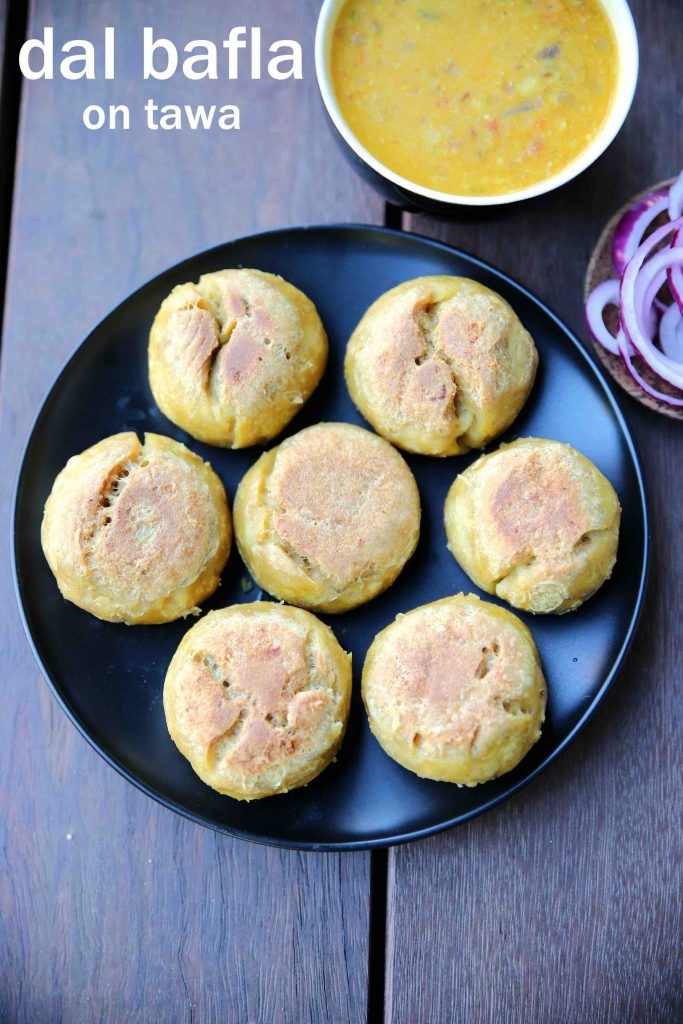 Dal Bafla is influenced by the Rajasthani specialty dal bati, is a popular dish in Madhya Pradesh. Crispy baked wheat balls called bafla  cooked until they become crisp, and then dipped in ghee. It is eaten with spicy daal, pickles or curry.