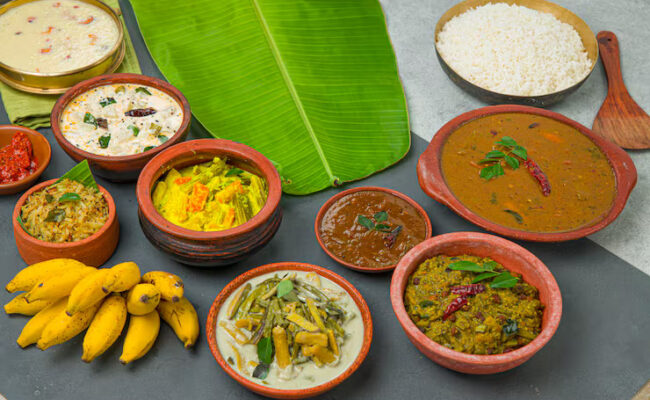 kerala-traditional-feast-side-dishes-cooked-rice-arranged-two-colour-background-with-fresh-green-banana-leaf-placed