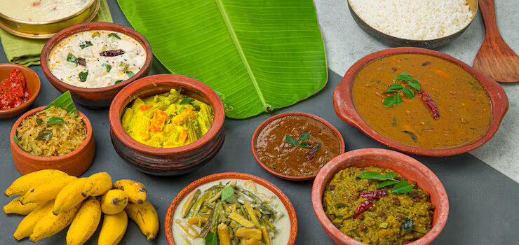 kerala-traditional-feast-side-dishes-cooked-rice-arranged-two-colour-background-with-fresh-green-banana-leaf-placed