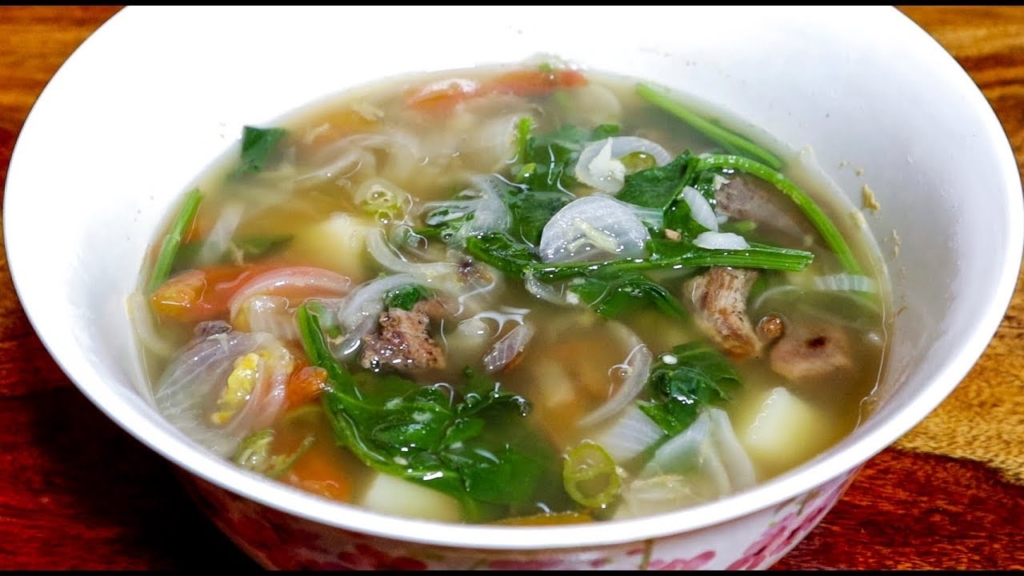 Kangsoi is a vegetable stew that consists of seasonal vegetables that are cooked and flavored with sliced cloves, garlic, onions, salt, maroi and a touch of ginger lidded with ngari, dried fish, or deep-fried fish items and water. The stew is mostly served with rice and consumed piping hot.